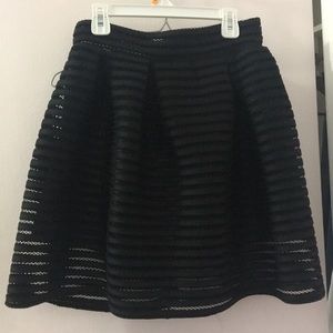 Black ruffle mini skirt